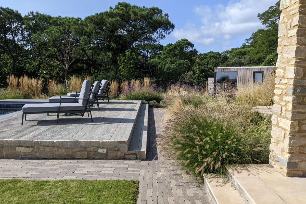 garden design in dorset and poole with a swimming pool and coastal planting